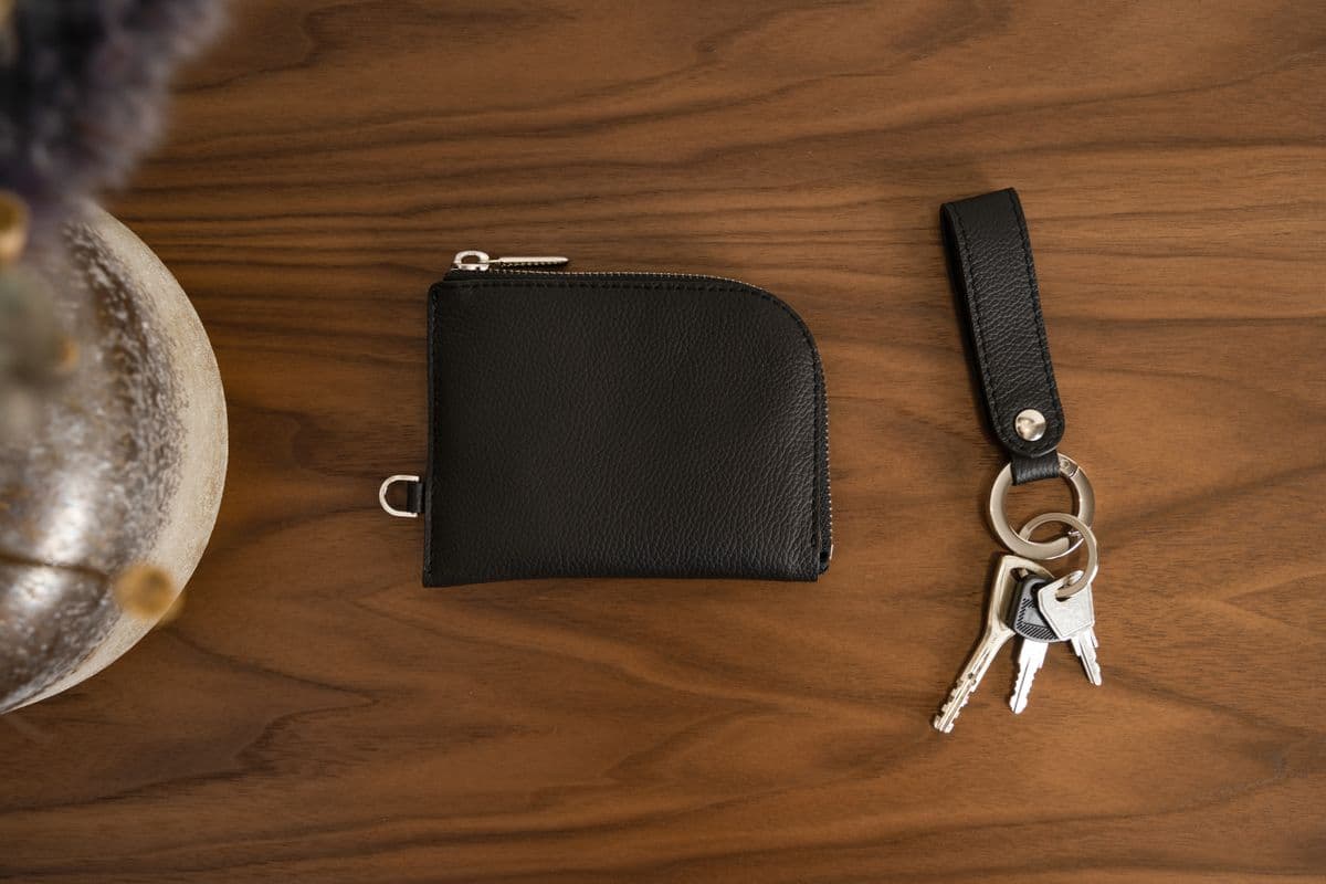 Leather wallet and keychain flatlay