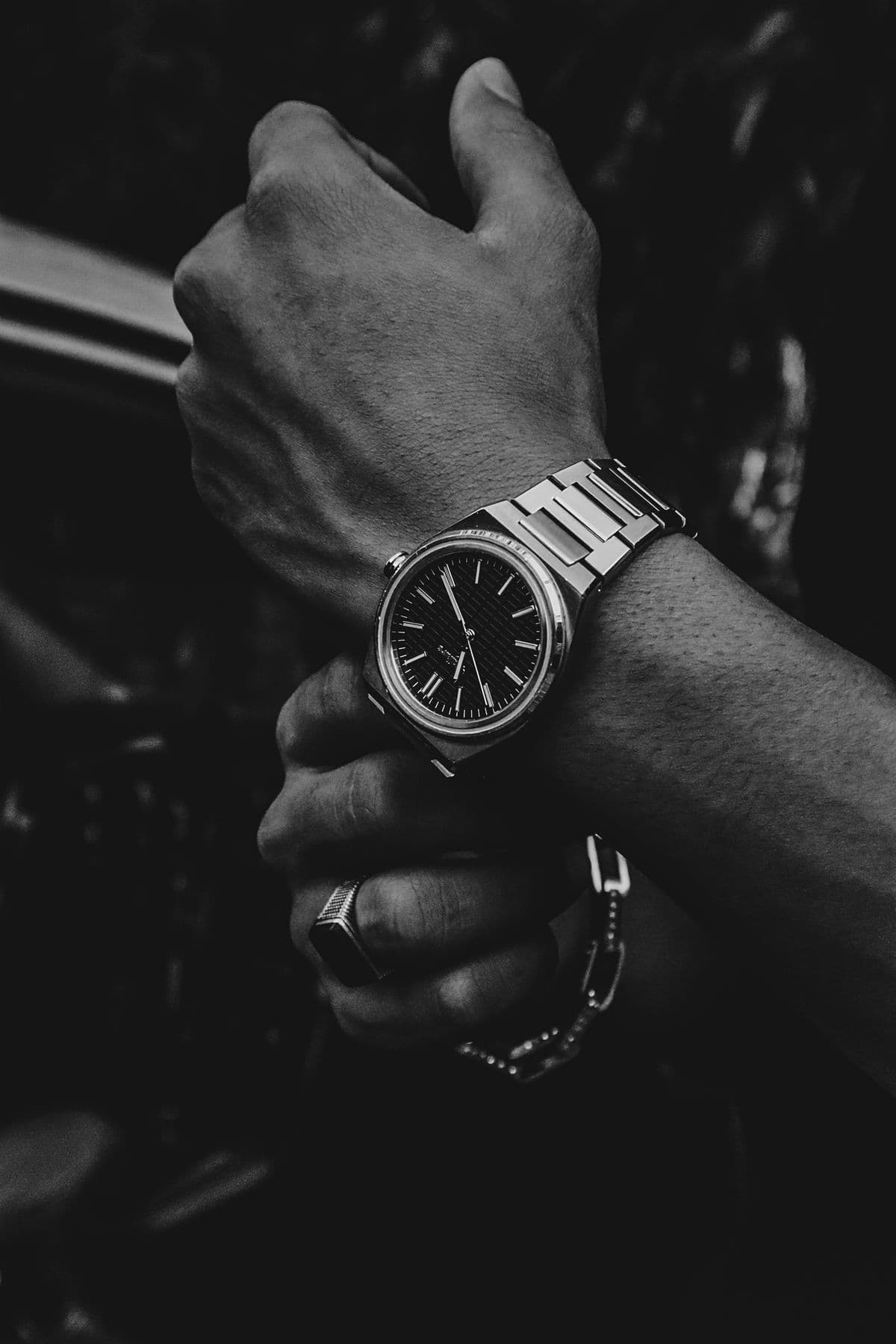 Watch, ring and bracelet detail on a man's wrist