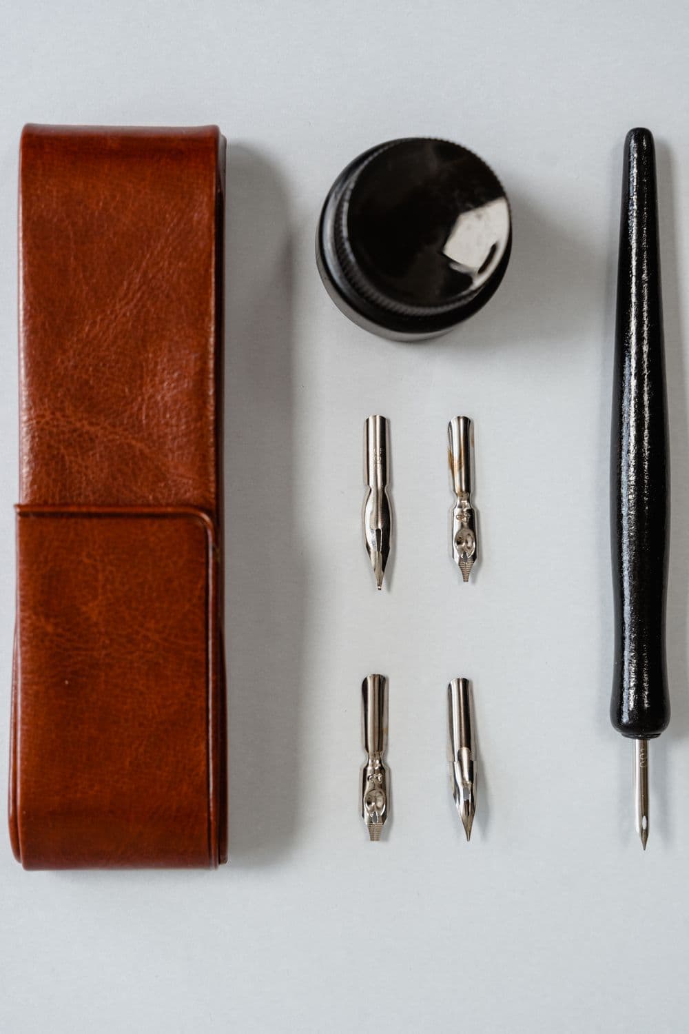 Leather case, ink bottle and pen writing set